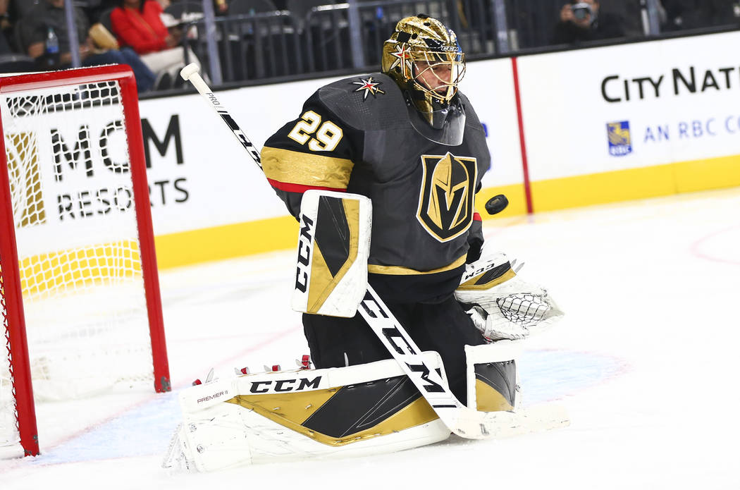 Golden Knights goaltender Marc-Andre Fleury (29) blocks a shot from the Los Angeles Kings durin ...