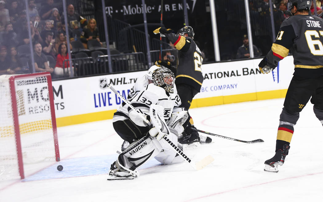 Los Angeles Kings goaltender Jonathan Quick (32) gives up a goal to Golden Knights' Max Paciore ...