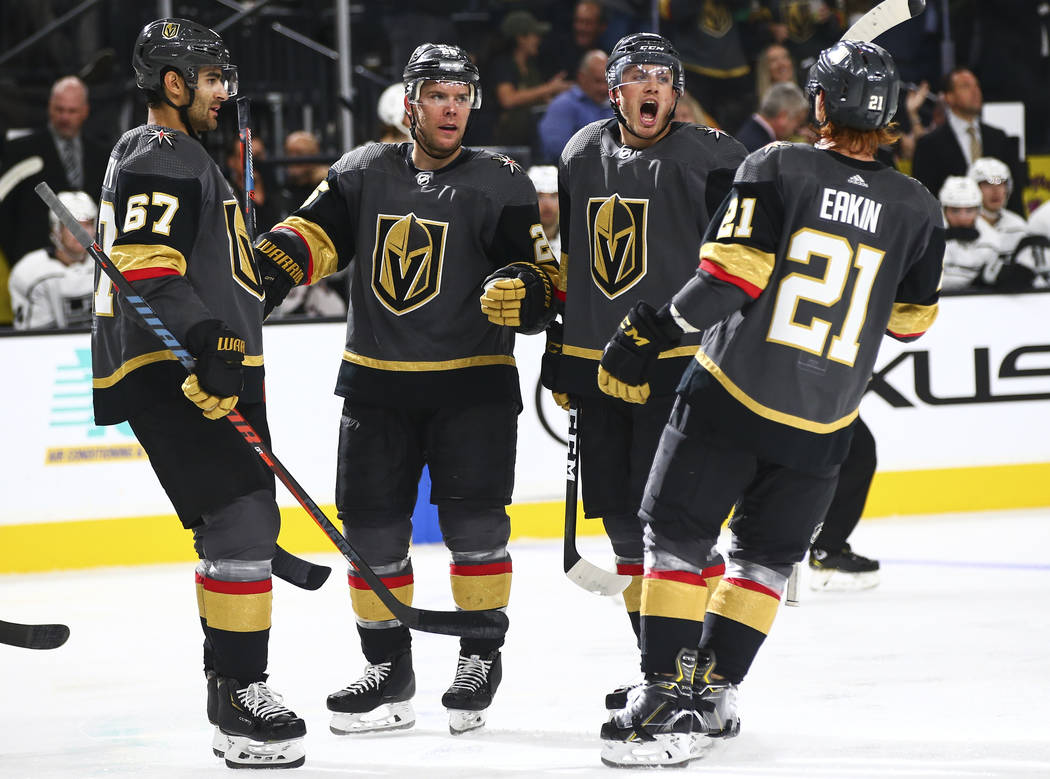 Golden Knights' Paul Stastny, second from left, celebrates with teammates, from left, Max Pacio ...