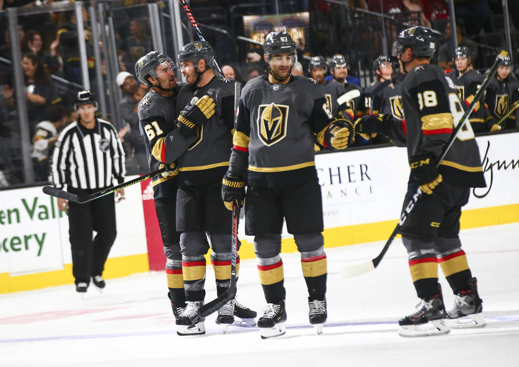 Golden Knights' Max Pacioretty, third from left, celebrates his goal with Nate Schmidt (88) alo ...