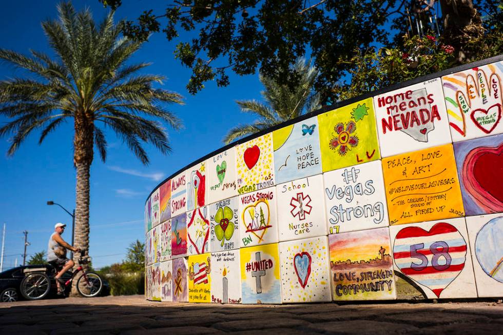 A view of tile mosaics that create a heart shaped planter box which surrounds the tree of life ...