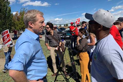 Democratic presidential candidate Tom Steyer speaks to Lance Pringle, president of UAW Local 21 ...