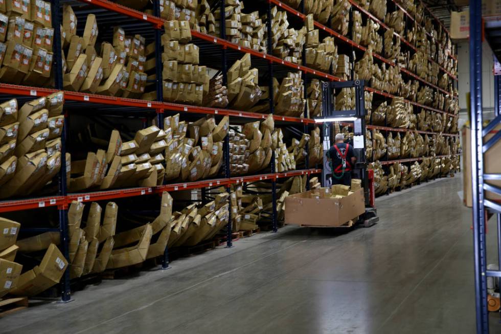 Cherry picker Ron Tomas fills orders at the new CarParts.com distribution facility in Las Vegas ...