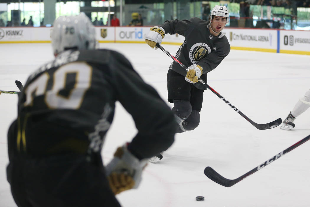 Vegas Golden Knights Nicolas Hague (14) makes a pass for an assist during a development camp sc ...