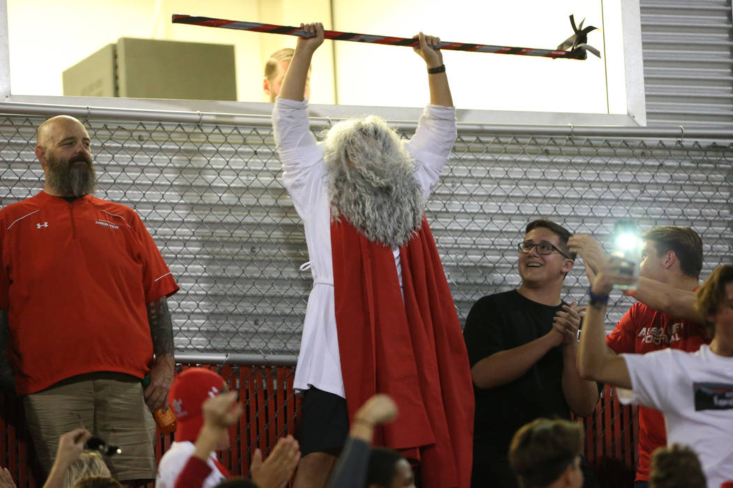 "Moses" makes his entrance to the football game between Arbor View against Centennial ...