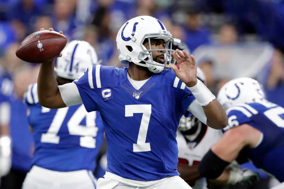 Indianapolis Colts quarterback Jacoby Brissett (7) throws during the first half of an NFL footb ...