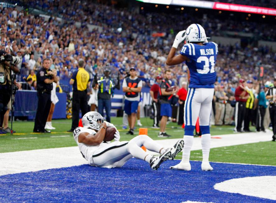 Oakland Raiders wide receiver Tyrell Williams (16) scores a touchdown as Indianapolis Colts cor ...