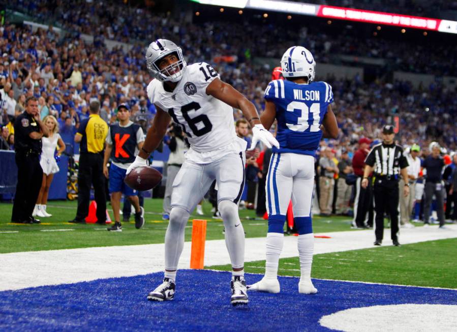 Oakland Raiders wide receiver Tyrell Williams (16) celebrates a touchdown score as defender Ind ...