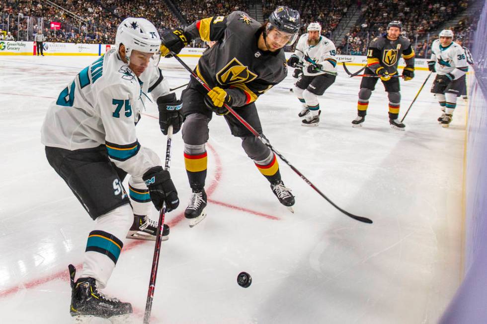 San Jose Sharks left wing Danil Yurtaykin (75) battles for control of the puck with Vegas Golde ...