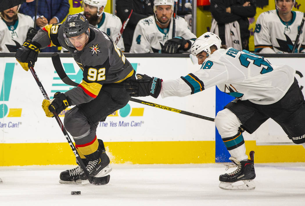 Vegas Golden Knights left wing Tomas Nosek (92) sets up a shot attempt over San Jose Sharks def ...