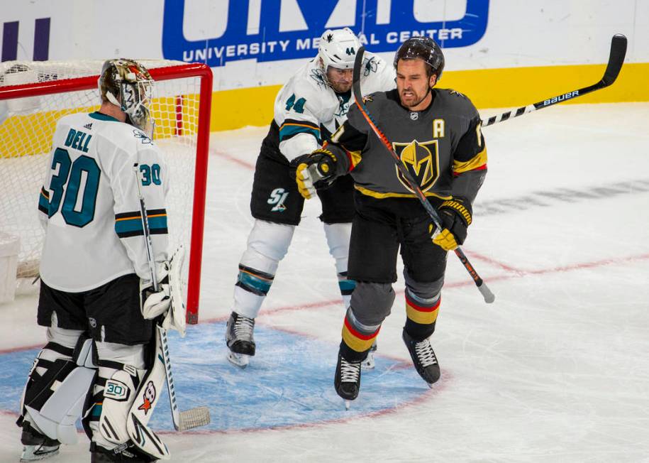 San Jose Sharks defenseman Marc-Edouard Vlasic (44) strikes Vegas Golden Knights right wing Mar ...