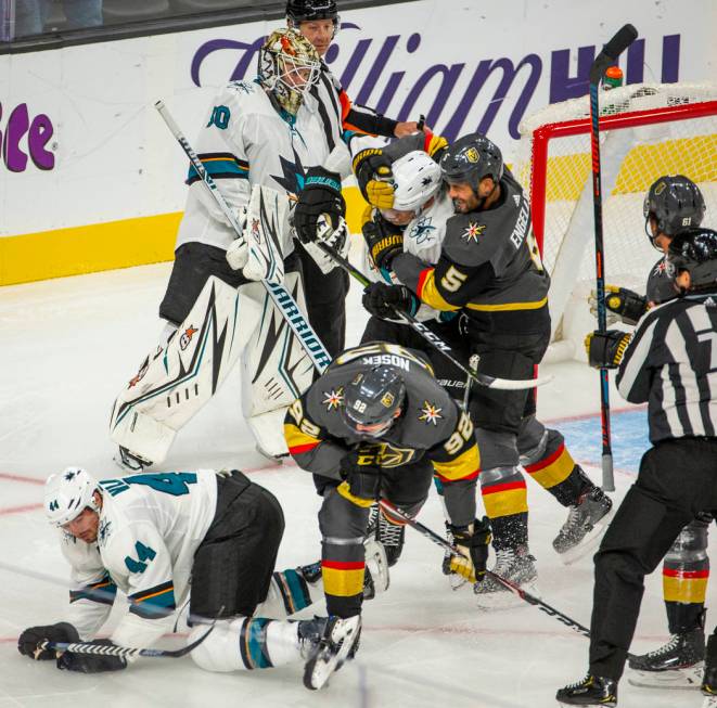 A fight breaks out on the ice after San Jose Sharks goaltender Aaron Dell (30) tripped up Vegas ...