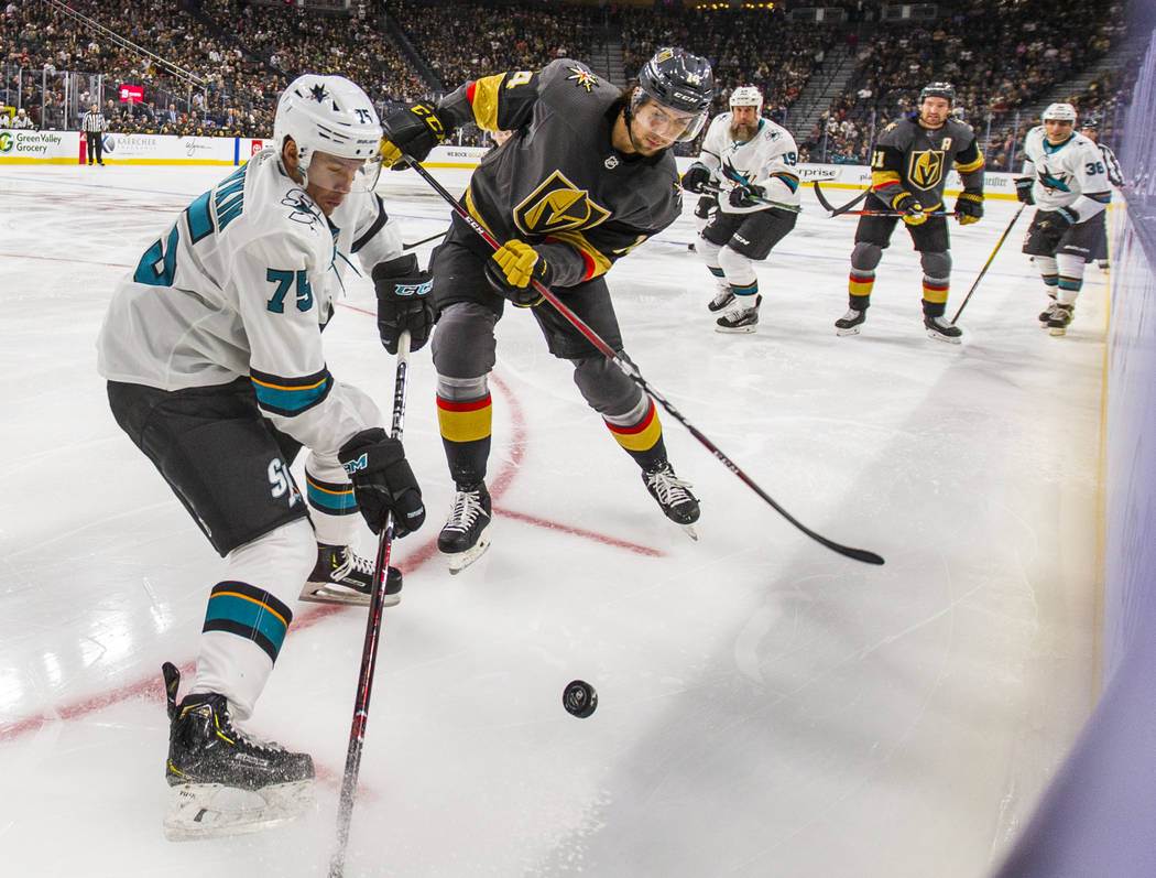 San Jose Sharks left wing Danil Yurtaykin (75) battles for control of the puck with Vegas Golde ...