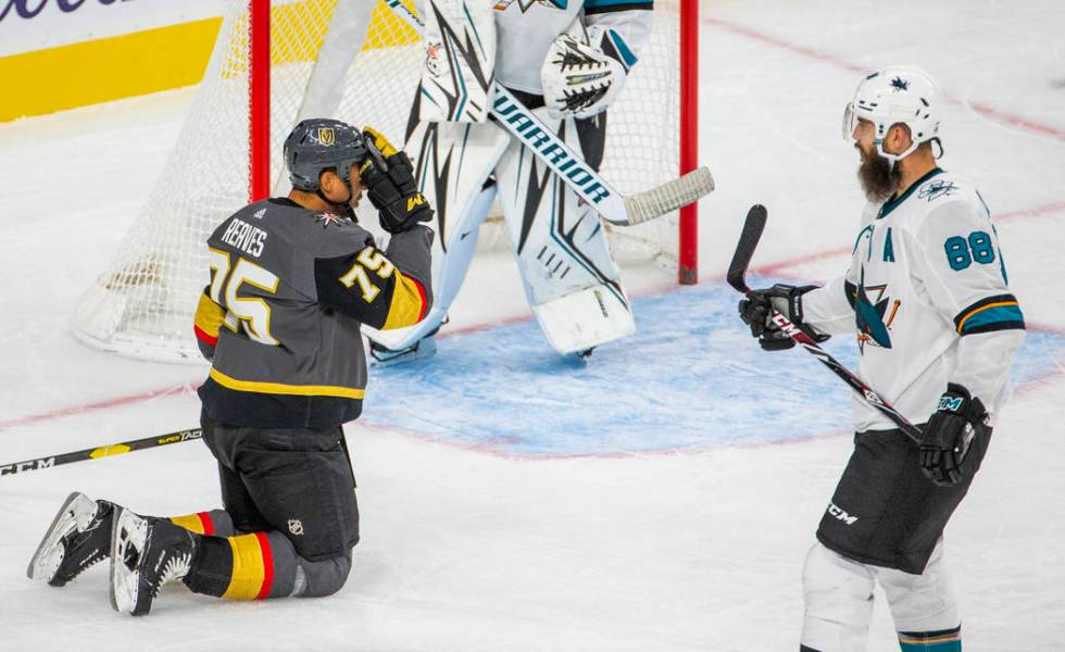 Vegas Golden Knights right wing Ryan Reaves (75) puts a glove to his face after being tripped u ...