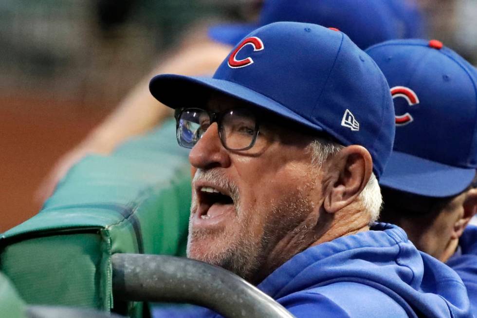 Chicago Cubs manager Joe Maddon yells from the dugout before the team's baseball game against t ...