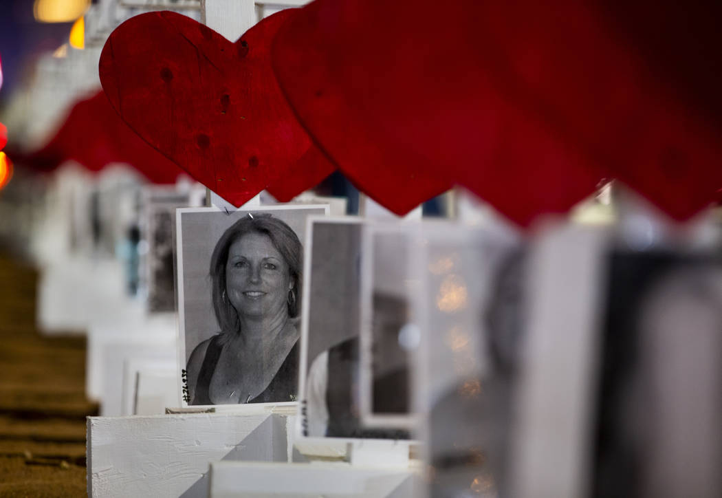 A photo of victim Dana Gardner joins the others on the 58 crosses placed by Greg Zanis near the ...