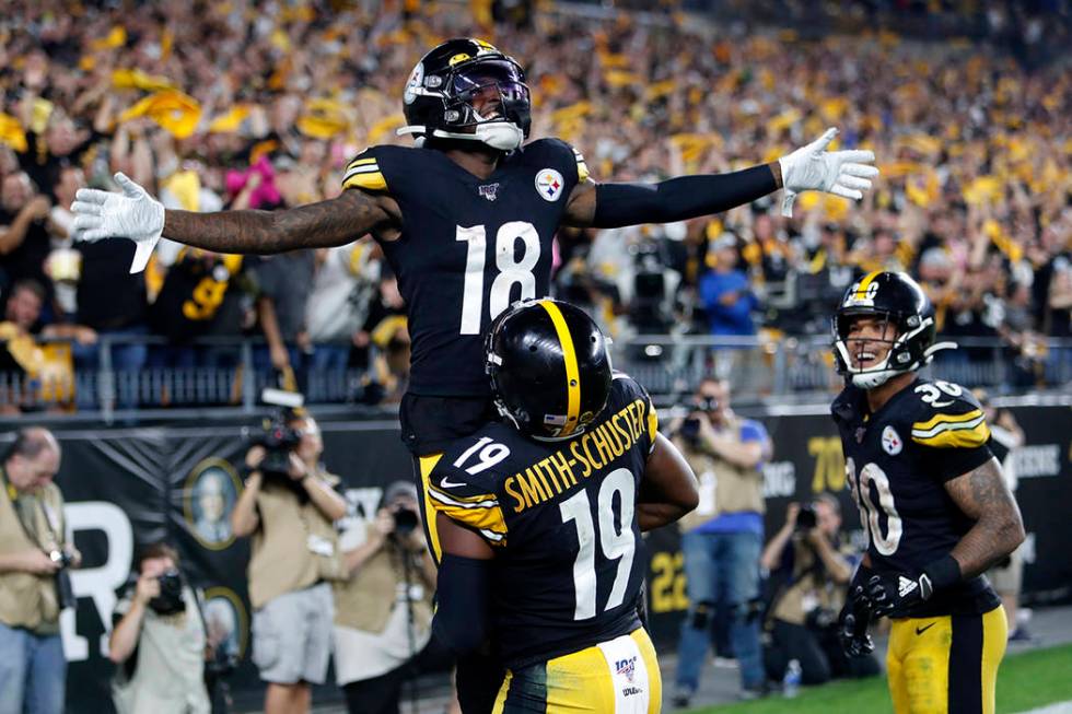 Pittsburgh Steelers wide receiver Diontae Johnson (18) celebrates with JuJu Smith-Schuster (19) ...