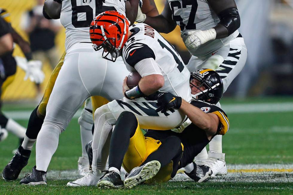 Pittsburgh Steelers outside linebacker T.J. Watt (90) sacks Cincinnati Bengals quarterback Andy ...