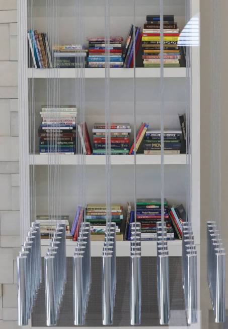 Books and light fixture are seen inside a clubhouse at Empire apartment complex on Friday, Aug. ...