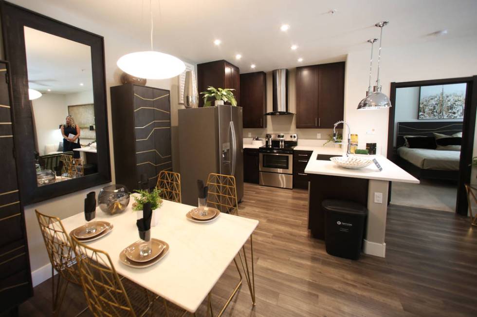 Dining area, a kitchen and a master bedroom are seen at Empire apartment complex is seen on Fri ...