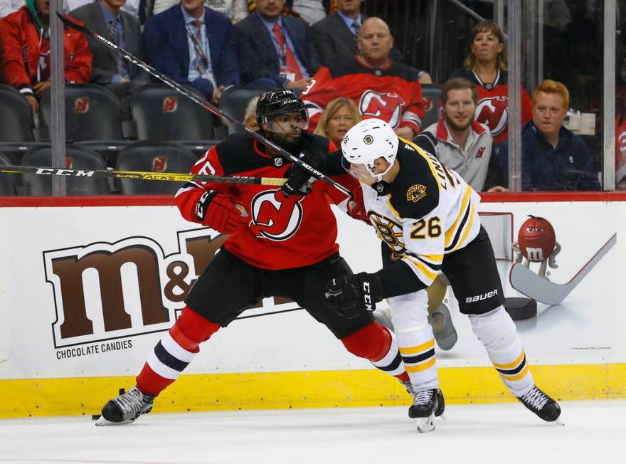 New Jersey Devils defenseman P.K. Subban (76) battle Boston Bruins center Par Lindholm (26) for ...
