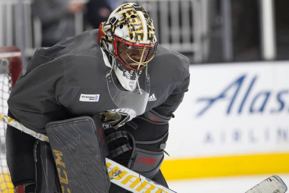 Golden Knights goaltender Malcolm Subban (30) peers out of his mask during practice on Thursday ...