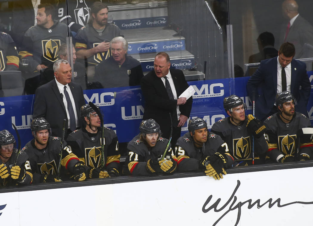 Golden Knights head coach Gerard Gallant, center, reacts during the third period of an NHL hock ...