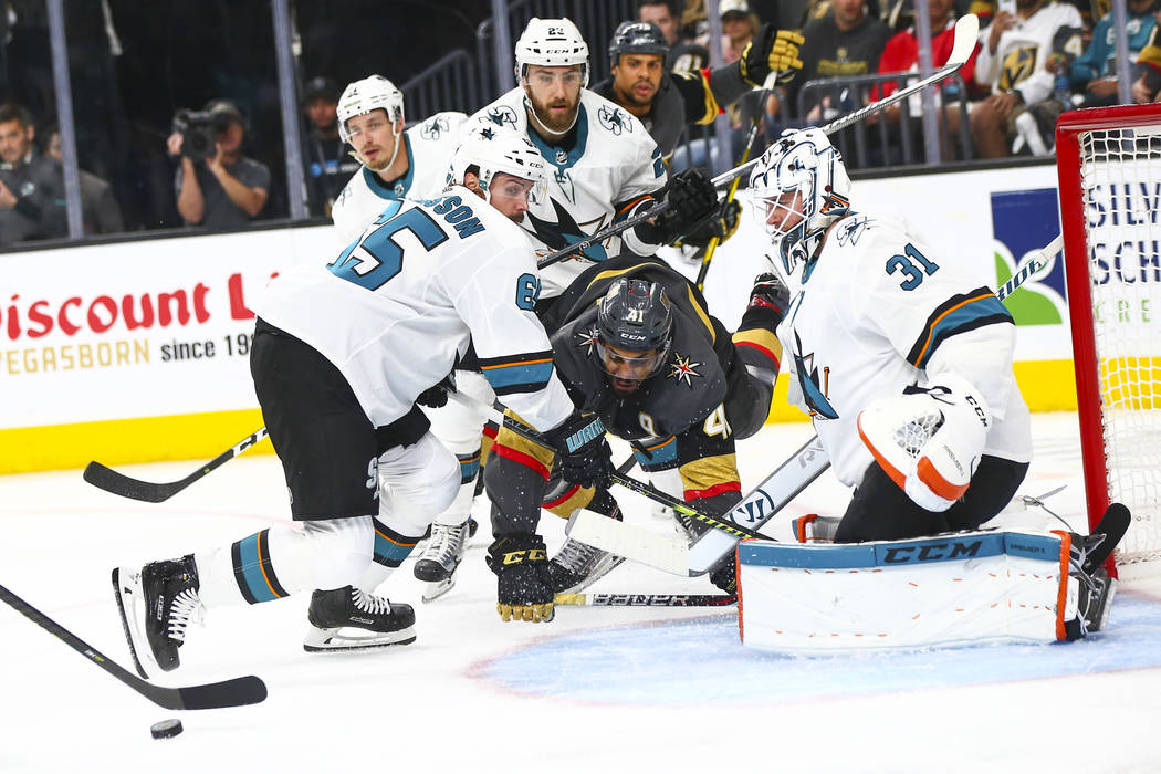 San Jose Sharks goaltender Martin Jones (31) and defenseman Erik Karlsson (65) block a shot fro ...