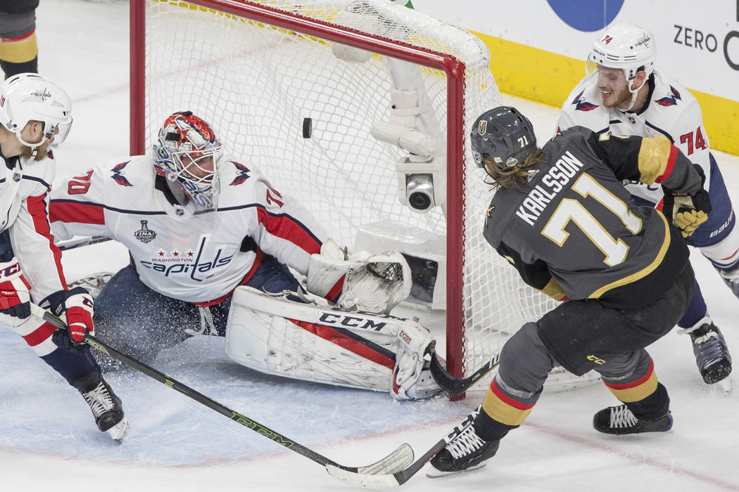 Golden Knights center William Karlsson (71) scores a first-period goal against Capitals goalten ...