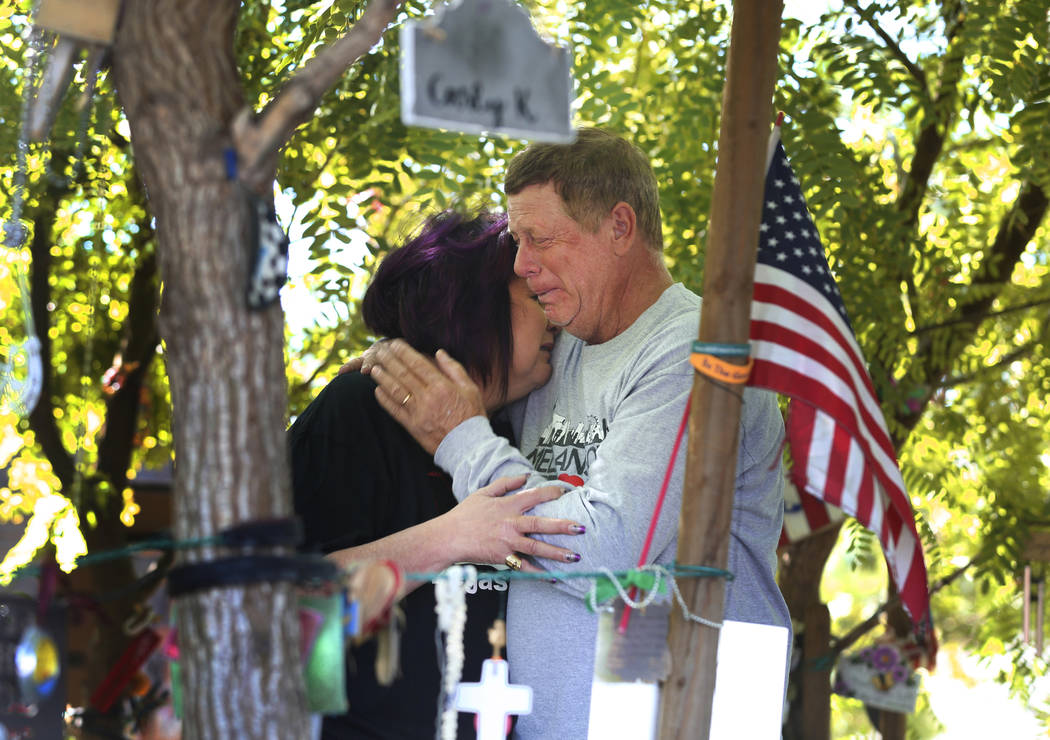 Oct. 1 shooting survivor Rosemarie Melanson, 55, and her husband Steve, 61, comfort each other ...