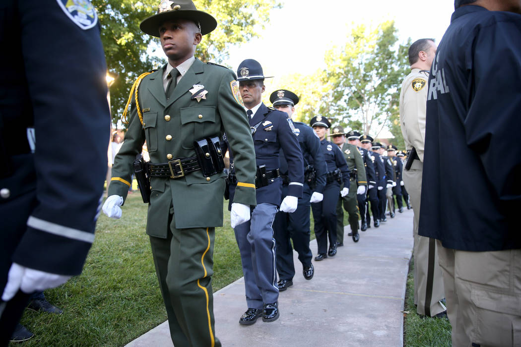 Members of the honor guard at the Clark County Government Center amphitheater in Las Vegas Tues ...