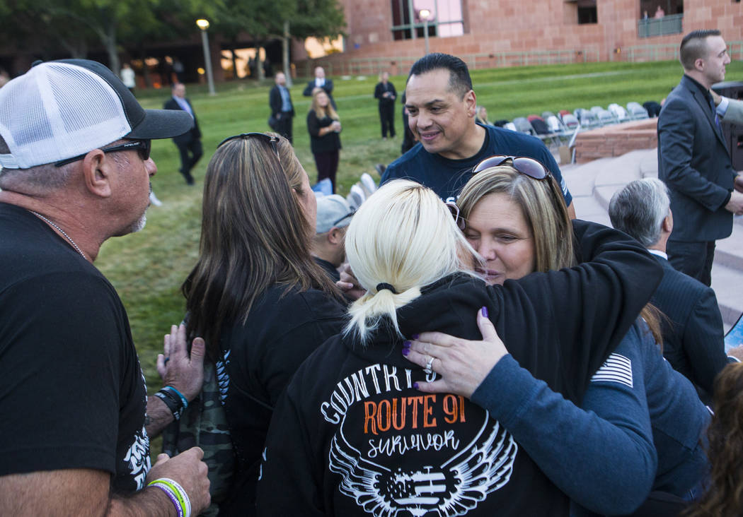 Mary Rivera, mother of Jordyn Rivera, who died in the Route 91 Harvest festival, right, embrace ...