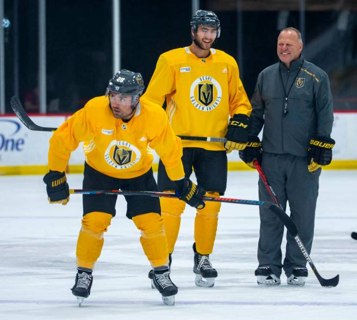 Vegas Golden Knights left wing William Carrier (28, left) and center Nicolas Roy (10) stand wit ...