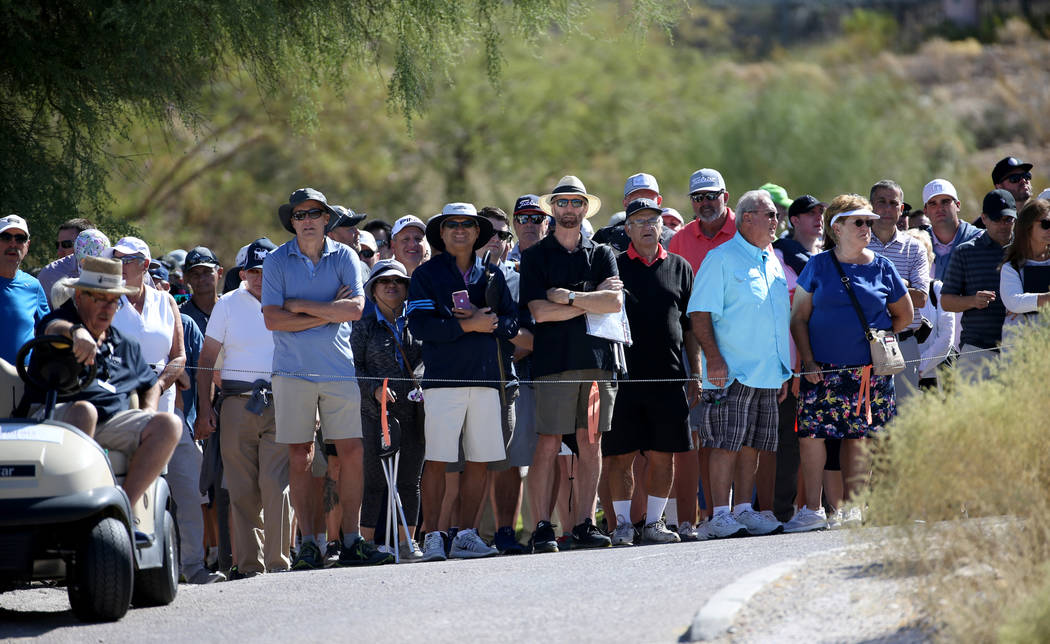 Fans watch Phil Mickelson, Tony Finau and Kevin Na, on the sixth hole during Shriners Hospitals ...