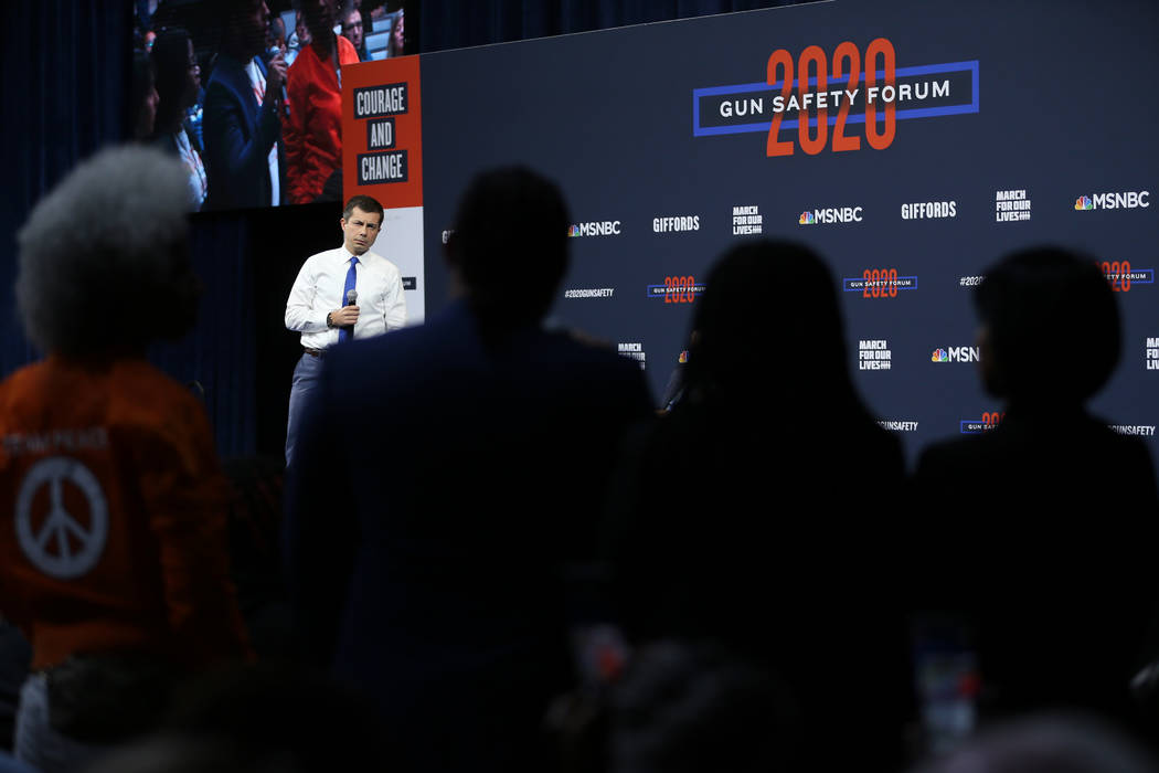 Democratic presidential candidate Pete Buttigieg takes a question from the audience during the ...