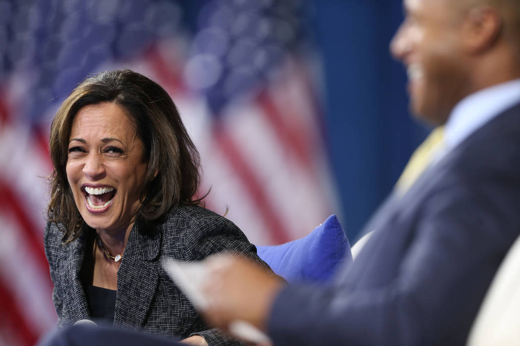 Democratic presidential candidate Kamala Harris, left, shares a laugh with forum host and journ ...