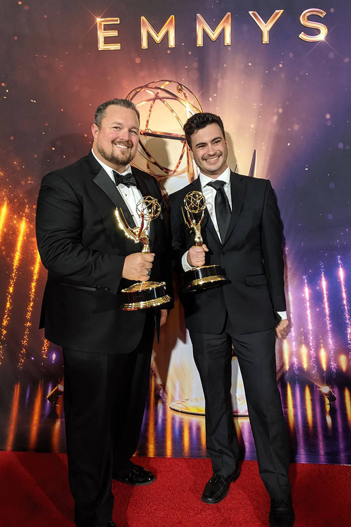 Las Vegas residents William O'Donnell, left, and Trace Dantzig hold their Emmys in September. T ...