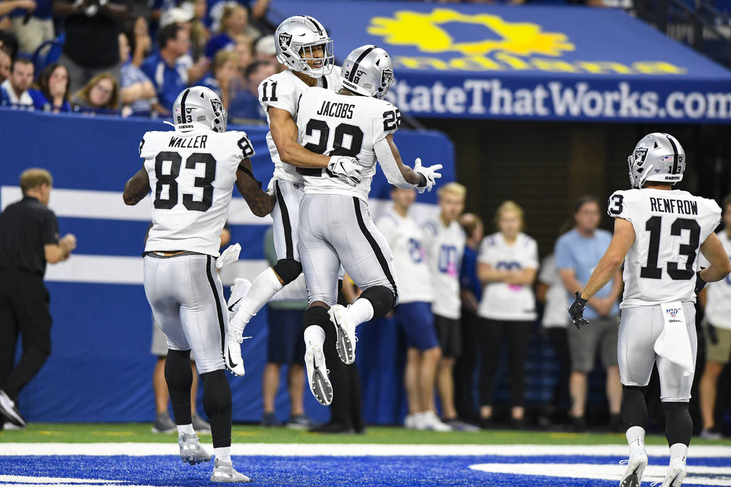 Oakland Raiders wide receiver Trevor Davis (11) celebrates a touchdown running back Josh Jacobs ...