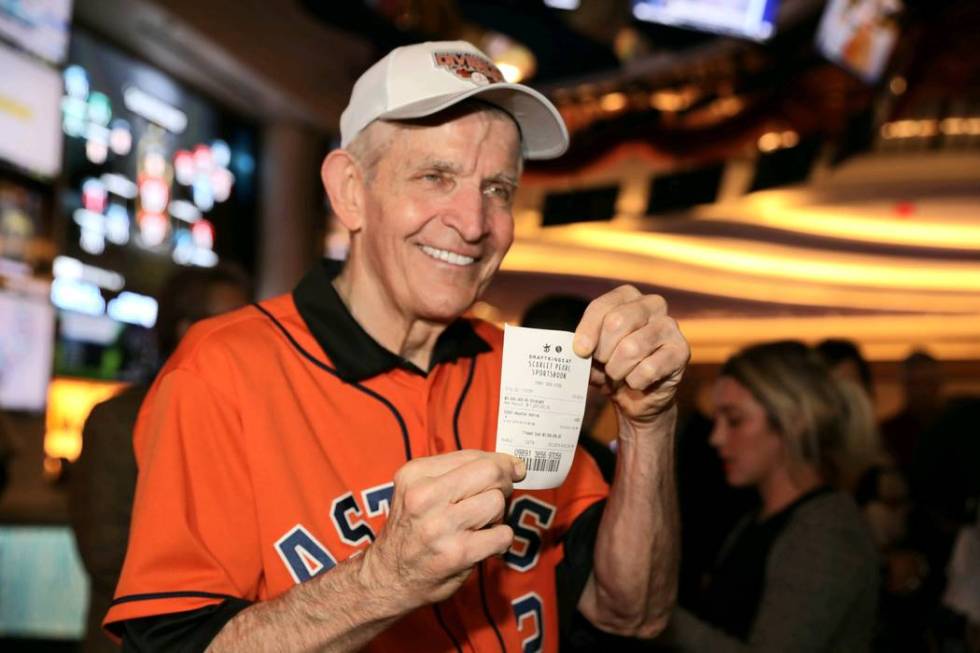 Jim “Mattress Mack” McIngvale holds his ticket after making a $3.5 million wager to win $7. ...