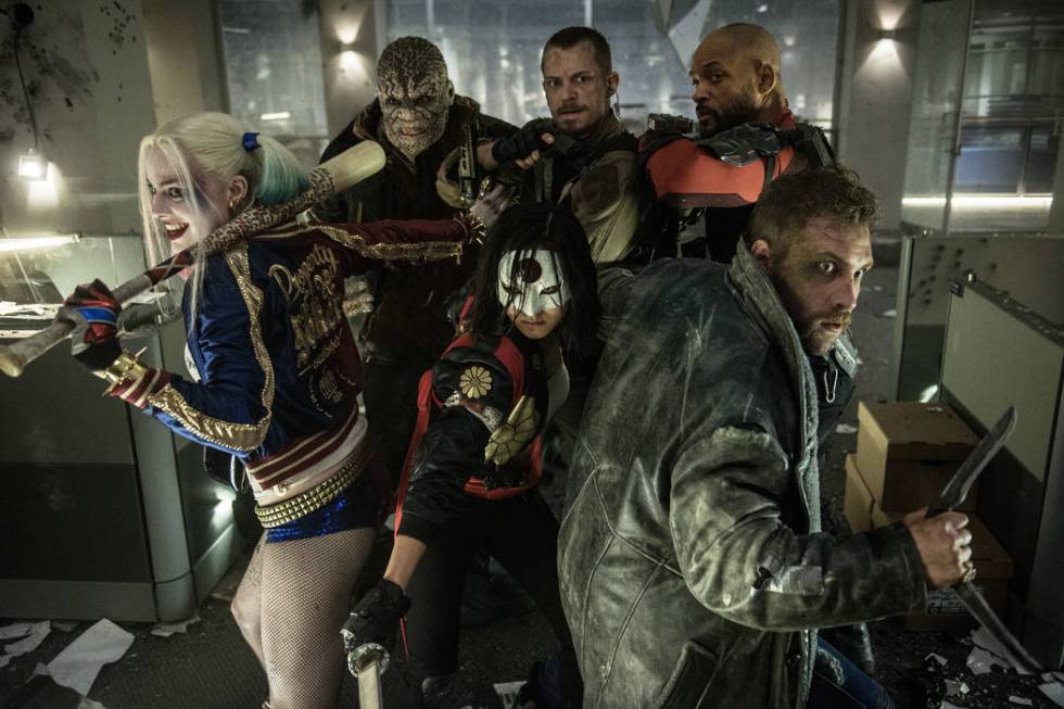 Margot Robbie as Harley Quinn, left, Adewale Akinnuoye-Agbaje as Killer Croc, Karen Fukuhara as ...