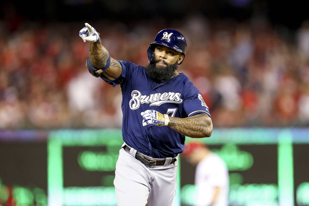 Milwaukee Brewers' Eric Thames gestures after hitting a solo home run during the second inning ...