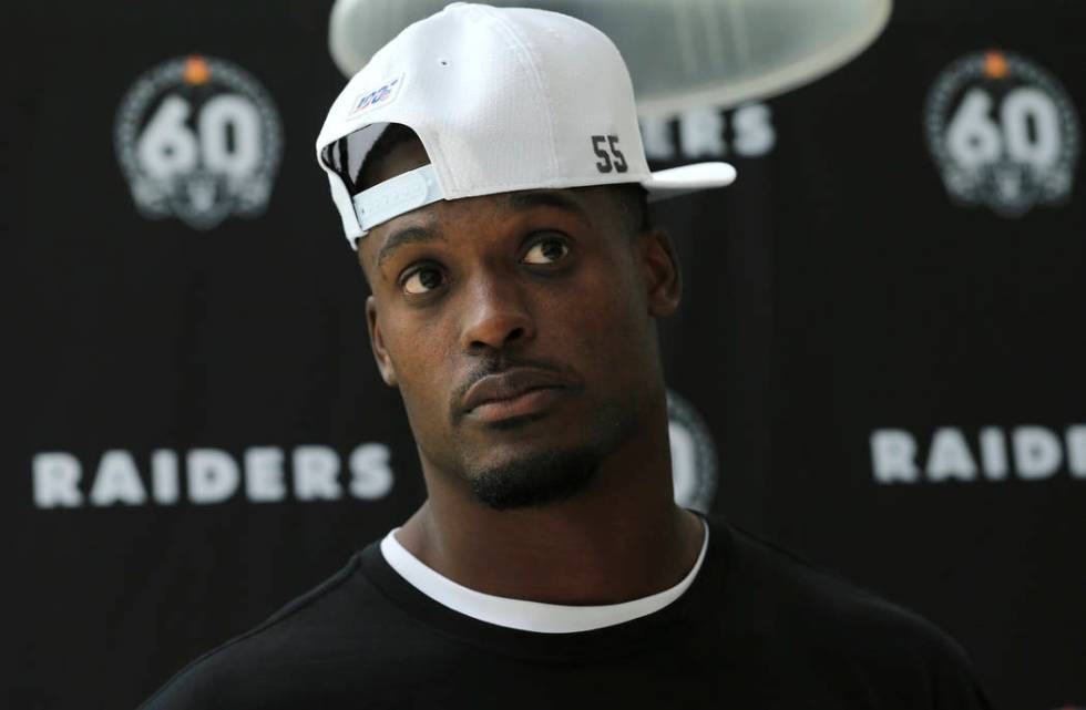 Oakland Raiders' linebacker Tahir Whitehead wears a cap with the number 55 in support of his ba ...