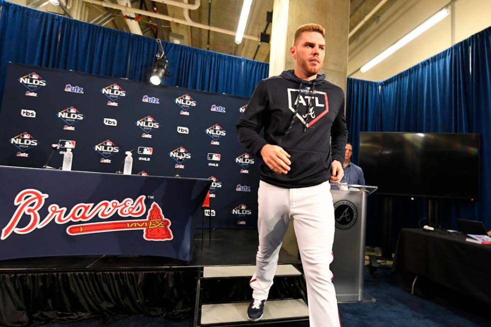 Atlanta Braves first baseman Freddie Freeman leaves a news conference before a baseball team wo ...