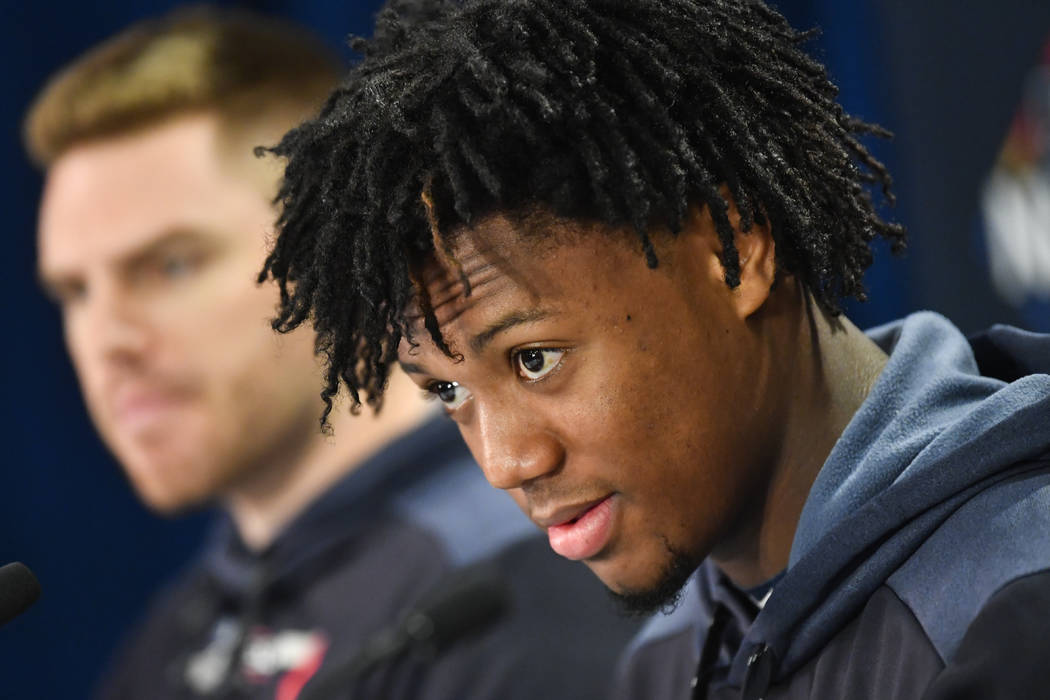 Atlanta Braves outfielder Ronald Acuna Jr., right, and first baseman Freddie Freeman attend a n ...