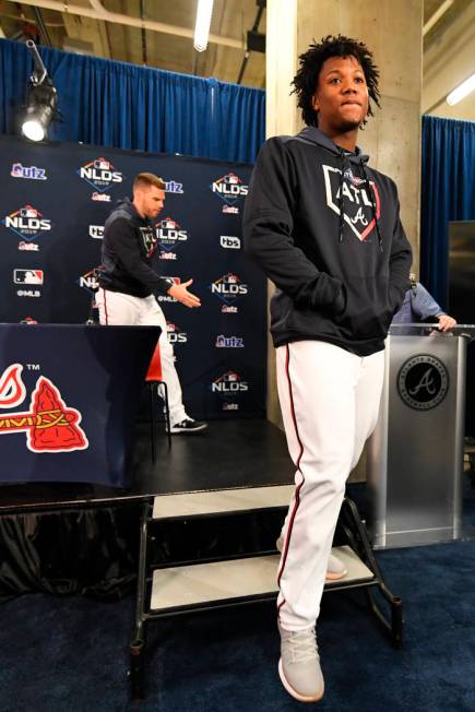 Atlanta Braves outfielder Ronald Acuna Jr. is followed by first baseman Freddie Freeman as they ...