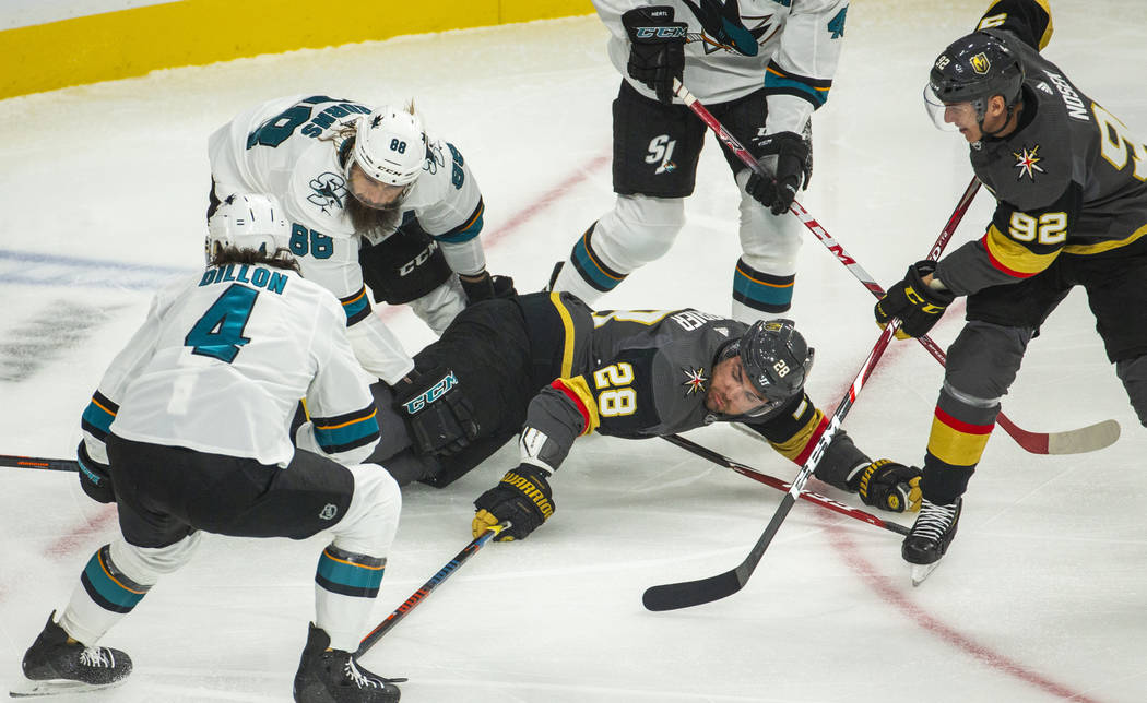 Vegas Golden Knights left wing William Carrier (28) attempts to hit the puck after being taken ...