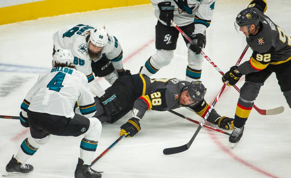 Vegas Golden Knights left wing William Carrier (28) attempts to hit the puck after being taken ...