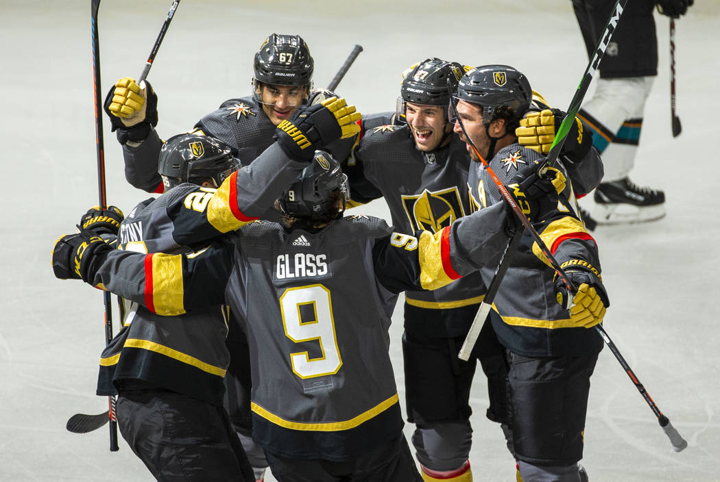 Golden Knights players celebrate after a goal by Mark Stone during the first period of their NH ...