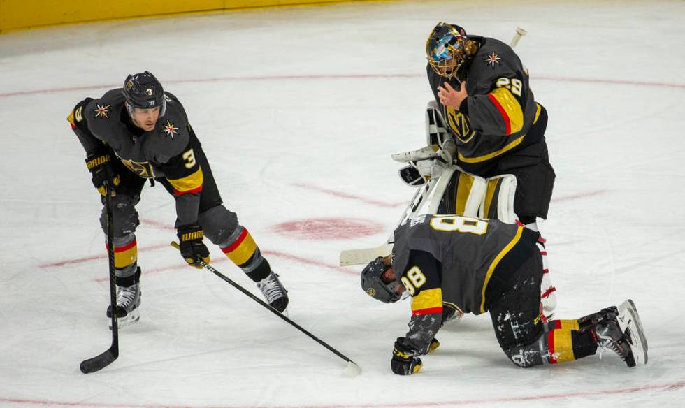 Vegas Golden Knights defenseman Nate Schmidt (88) is down injured on the ice versus the San Jos ...