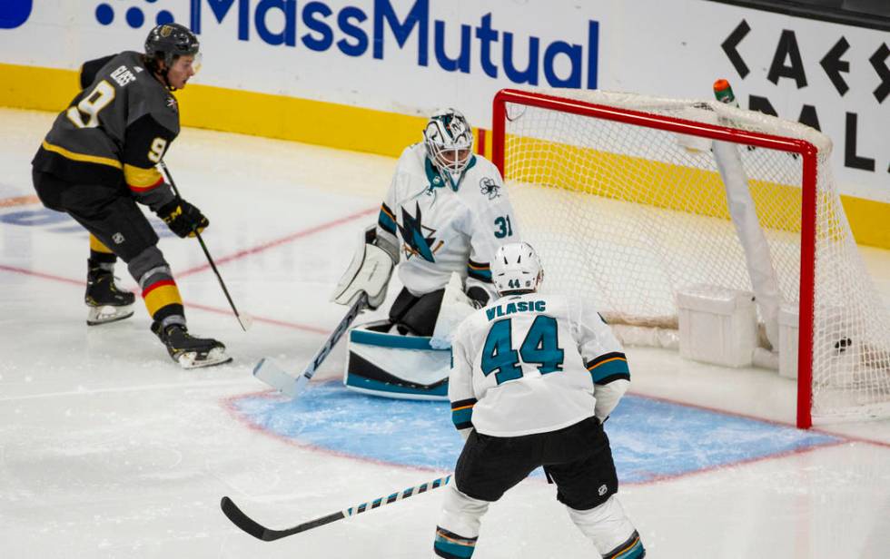 Vegas Golden Knights center Cody Glass (9) scores on San Jose Sharks goaltender Martin Jones (3 ...